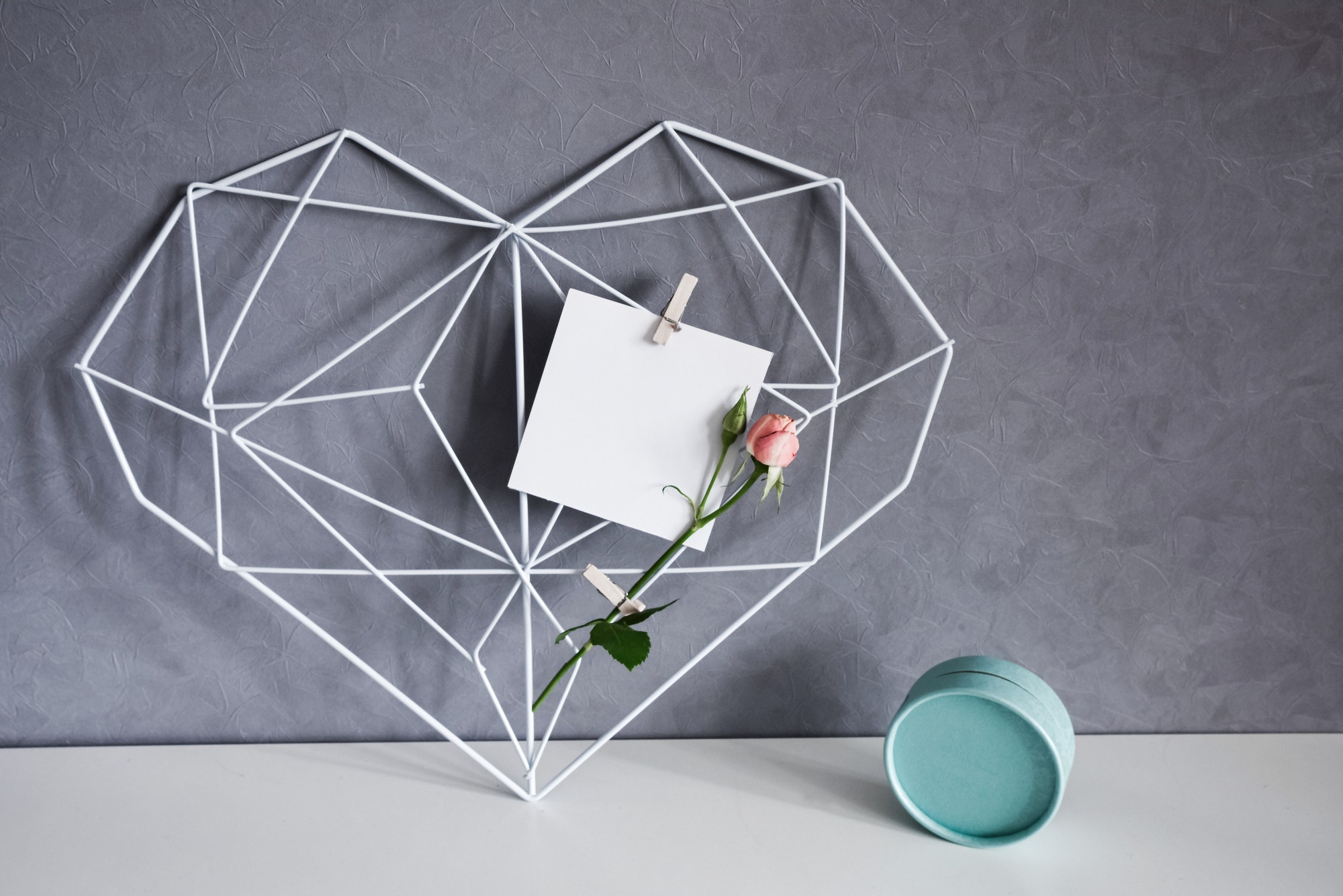 graphic-heart-of-polygons-with-note-rose-flower-gift-box-in-the-interior-valentine-s-day-concept.jpg